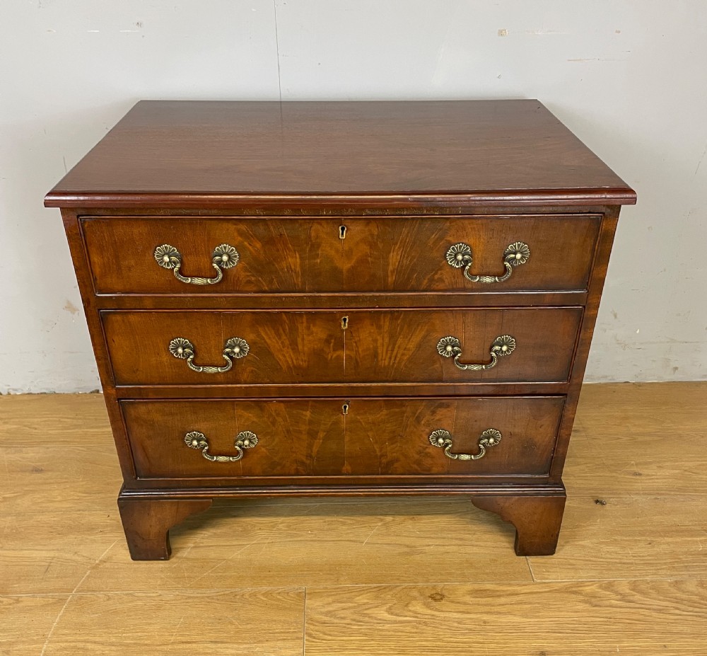 Small Edwardian three height flame mahogany chest of drawers 