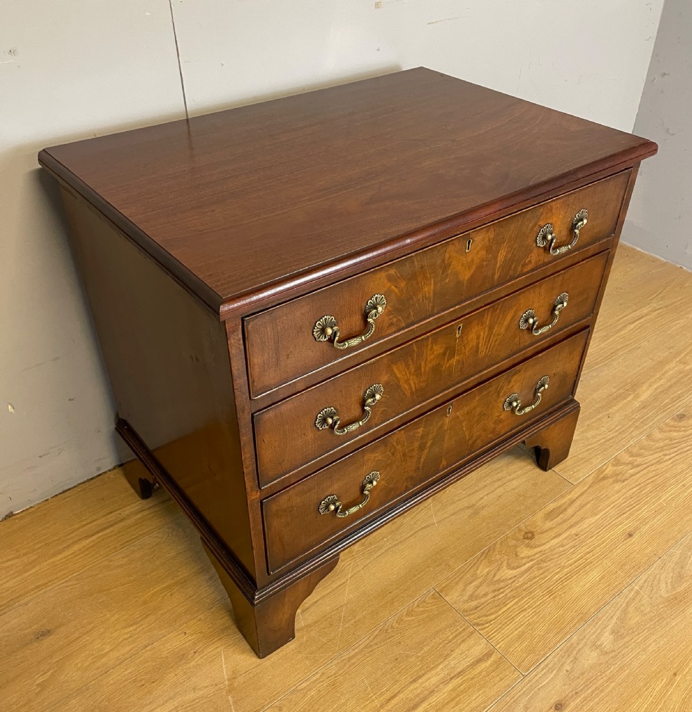 Small Edwardian three height flame mahogany chest of drawers  View II