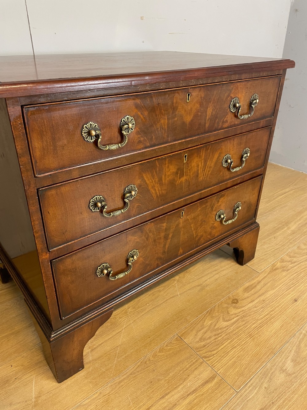 Small Edwardian three height flame mahogany chest of drawers  View III