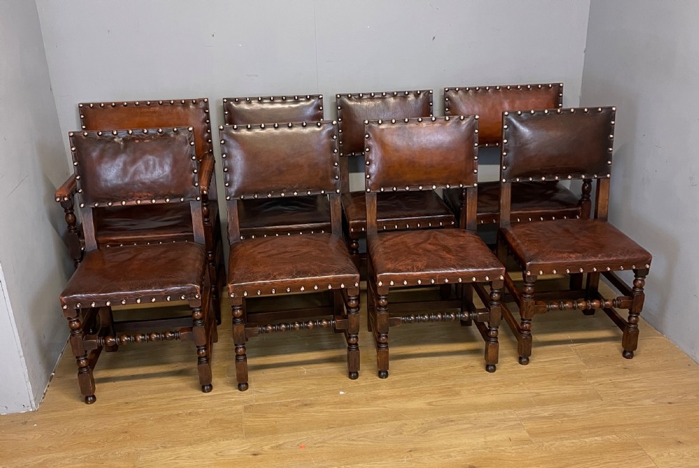 Eight Jacobean style leather and oak dining chairs circa 1890 View II