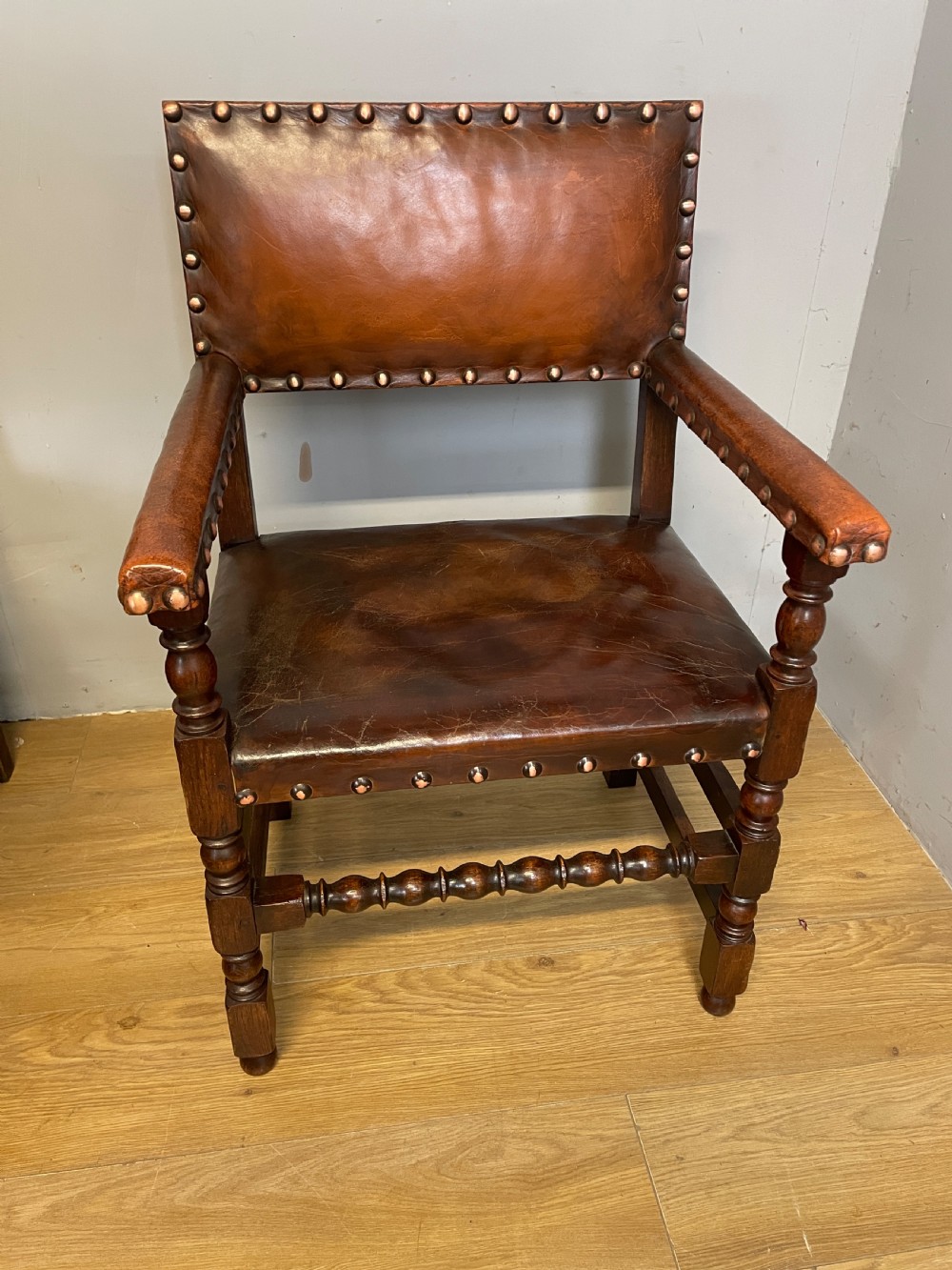 Eight Jacobean style leather and oak dining chairs circa 1890 View VI