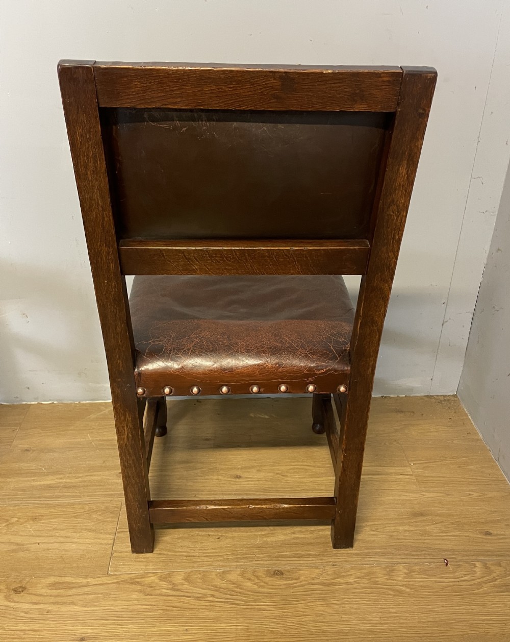 Eight Jacobean style leather and oak dining chairs circa 1890 View XIII