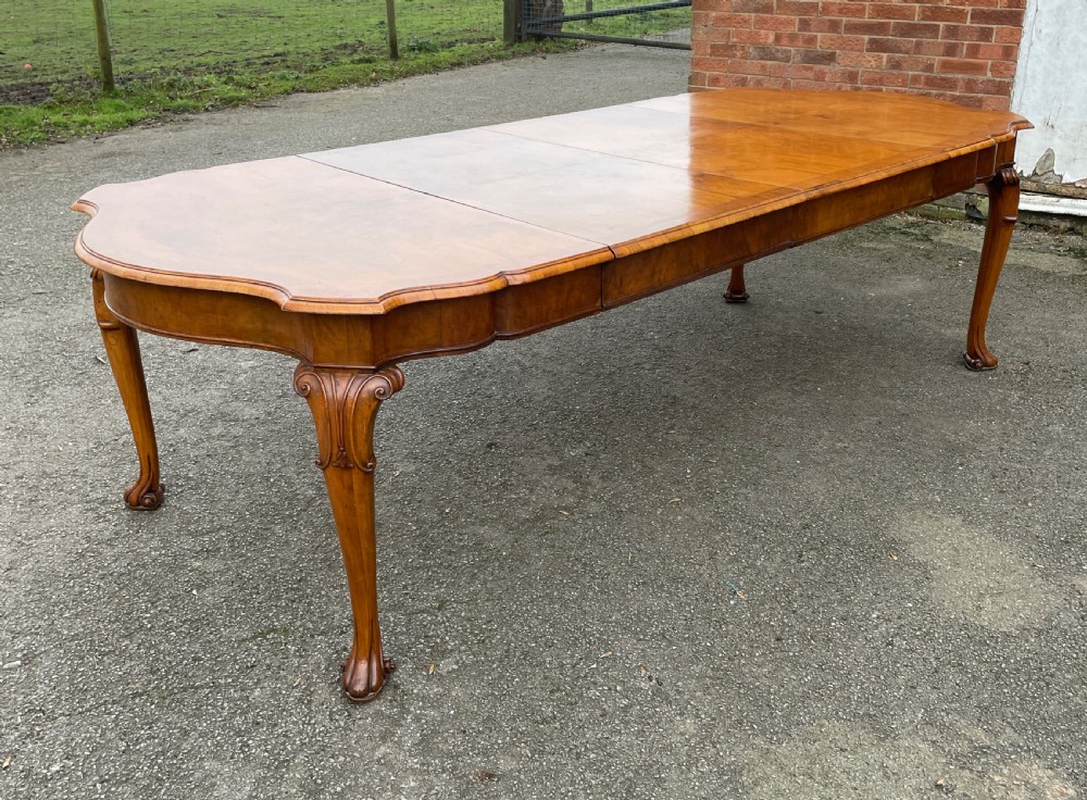 Burr walnut extending eight seater Queen Anne style dining table  View V