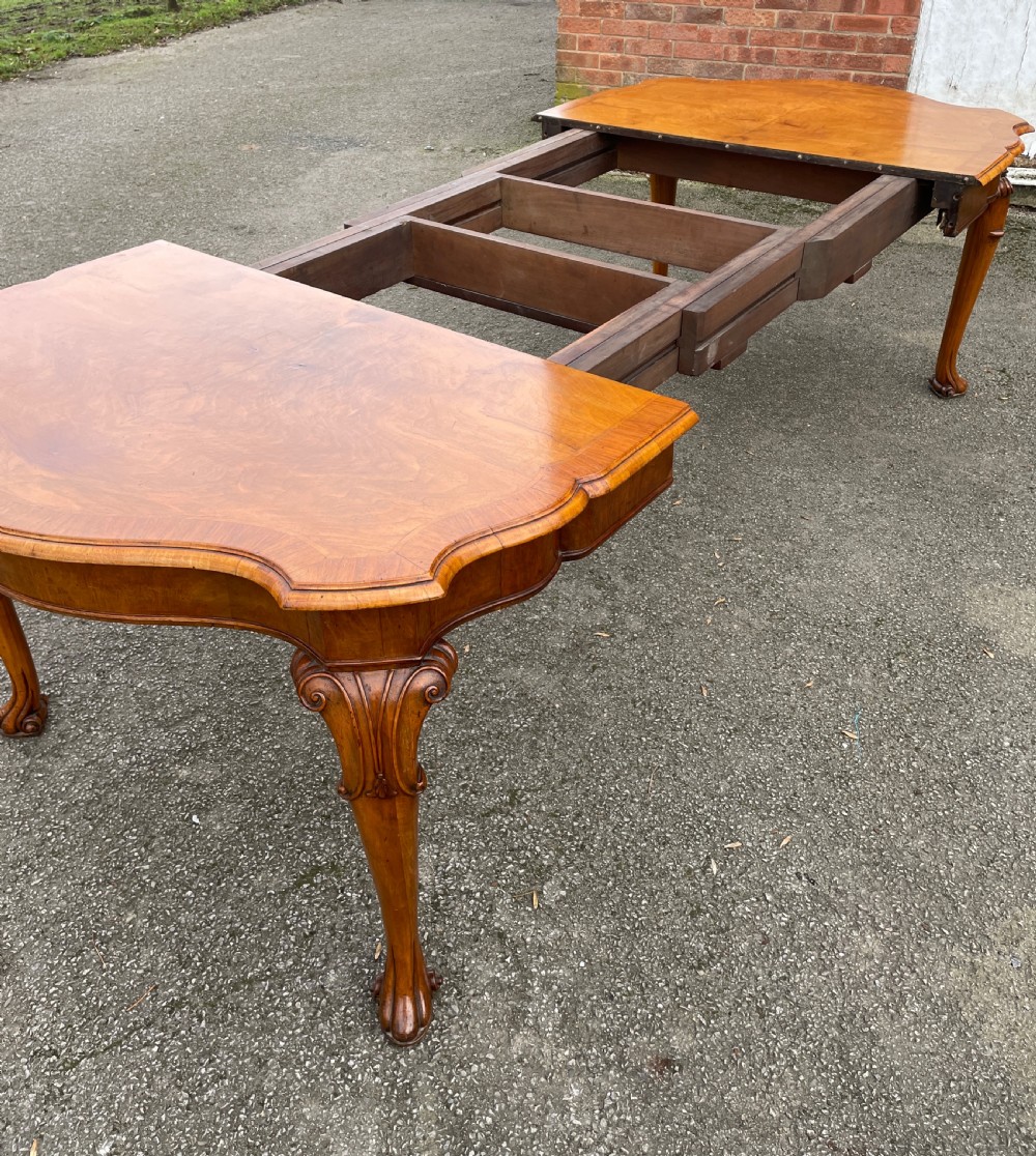 Burr walnut extending eight seater Queen Anne style dining table  View X