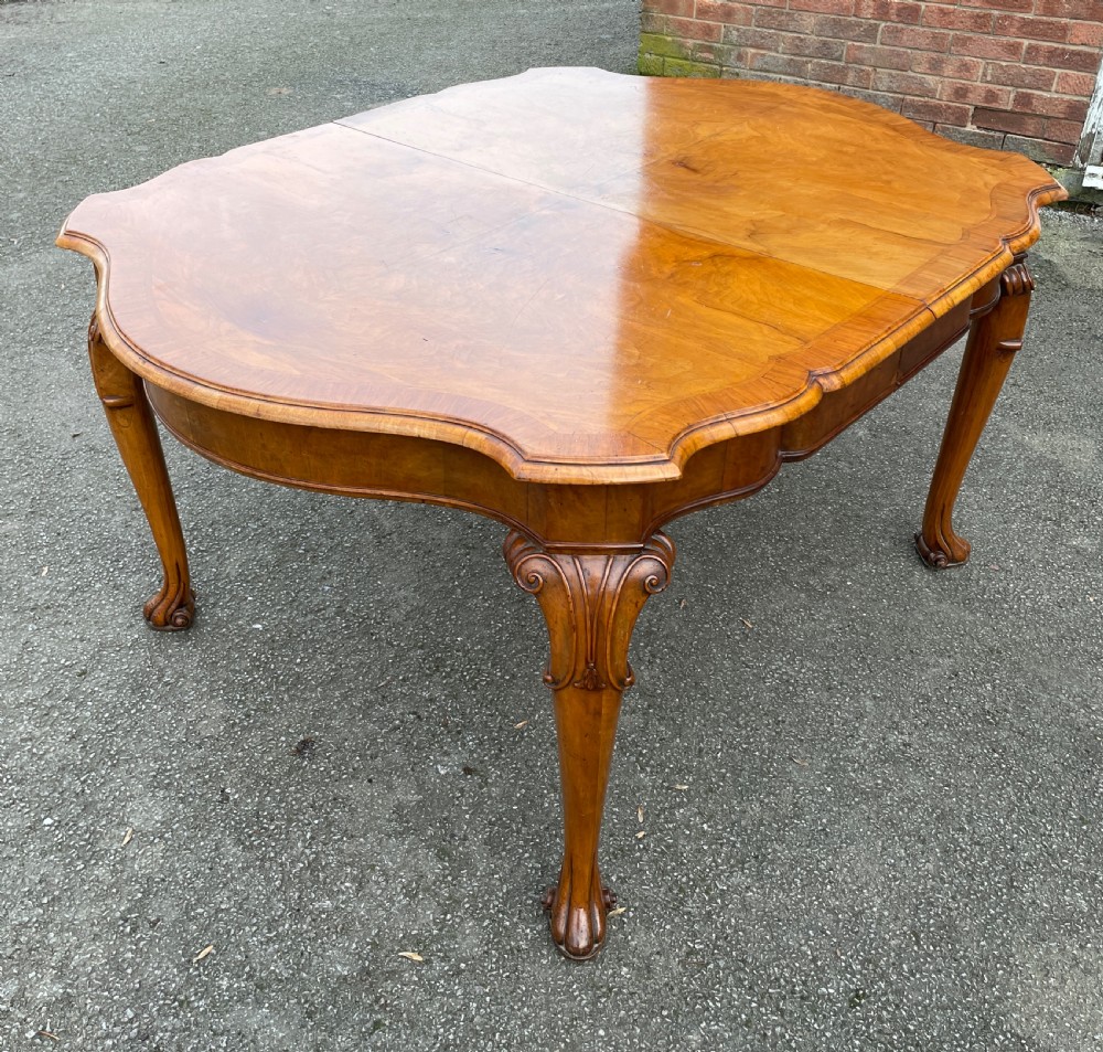Burr walnut extending eight seater Queen Anne style dining table  View XI