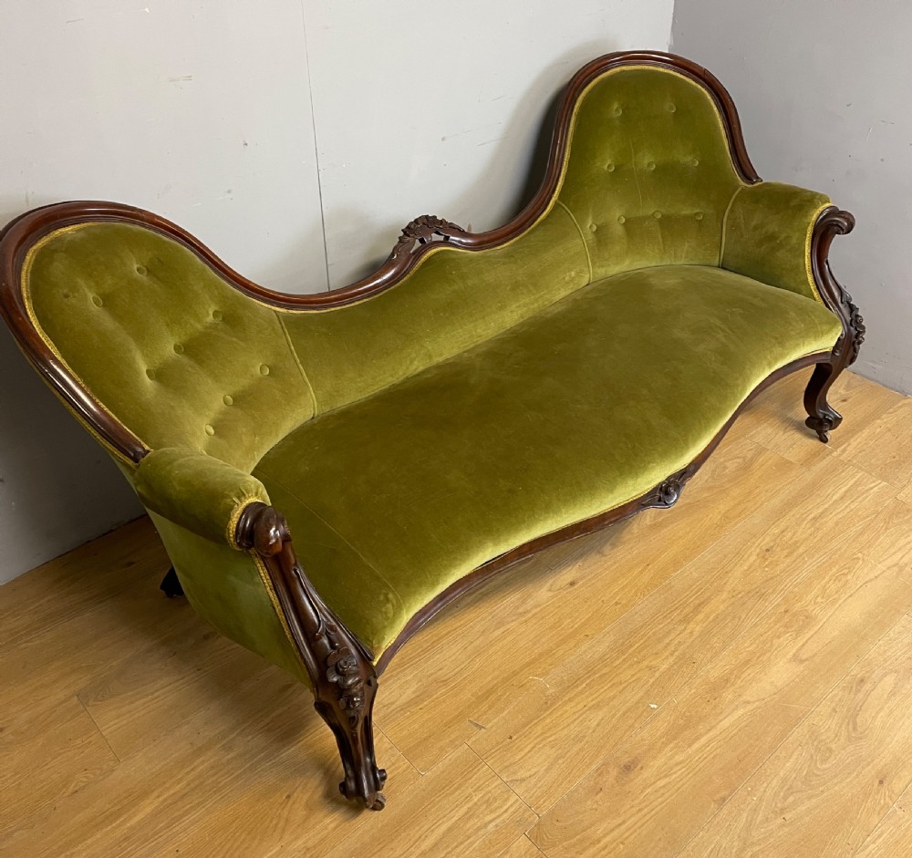 C19TH carved mahogany framed sofa in green velvet 