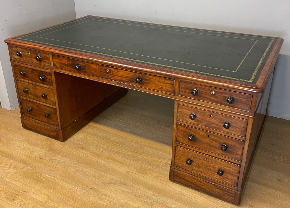 C19TH mahogany partners desk with inset tooled leather top 