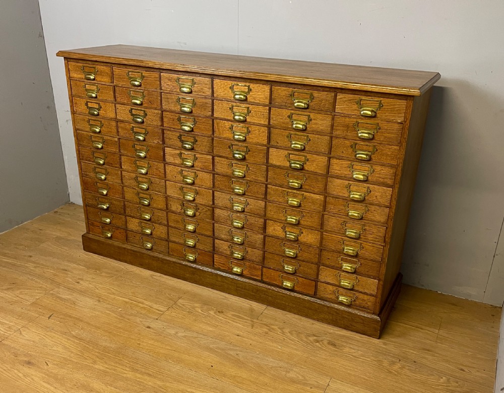 Edwardian set of 66 oak filing drawers with original brass fittings 