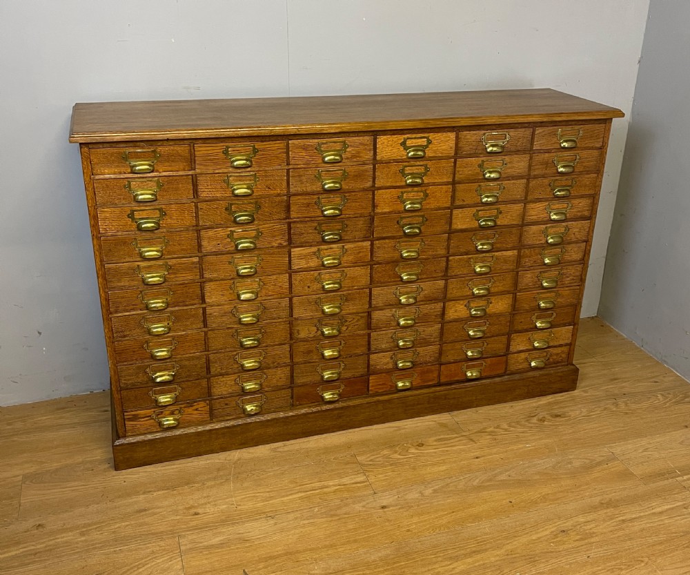 Edwardian set of 66 oak filing drawers with original brass fittings  View II