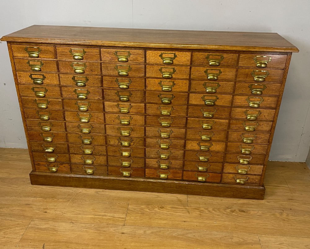 Edwardian set of 66 oak filing drawers with original brass fittings  View III