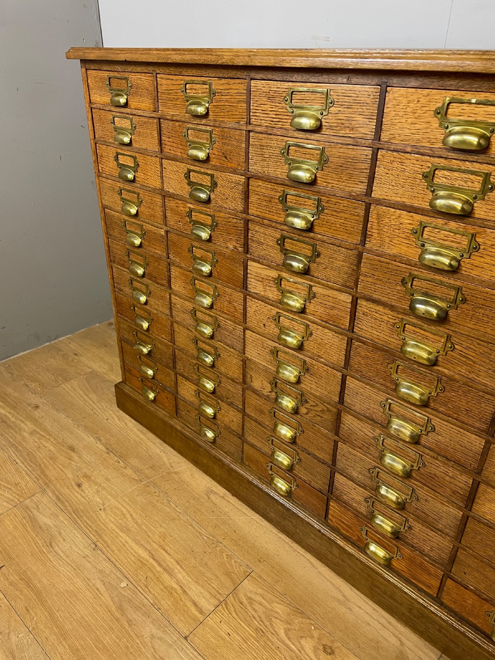 Edwardian set of 66 oak filing drawers with original brass fittings  View V