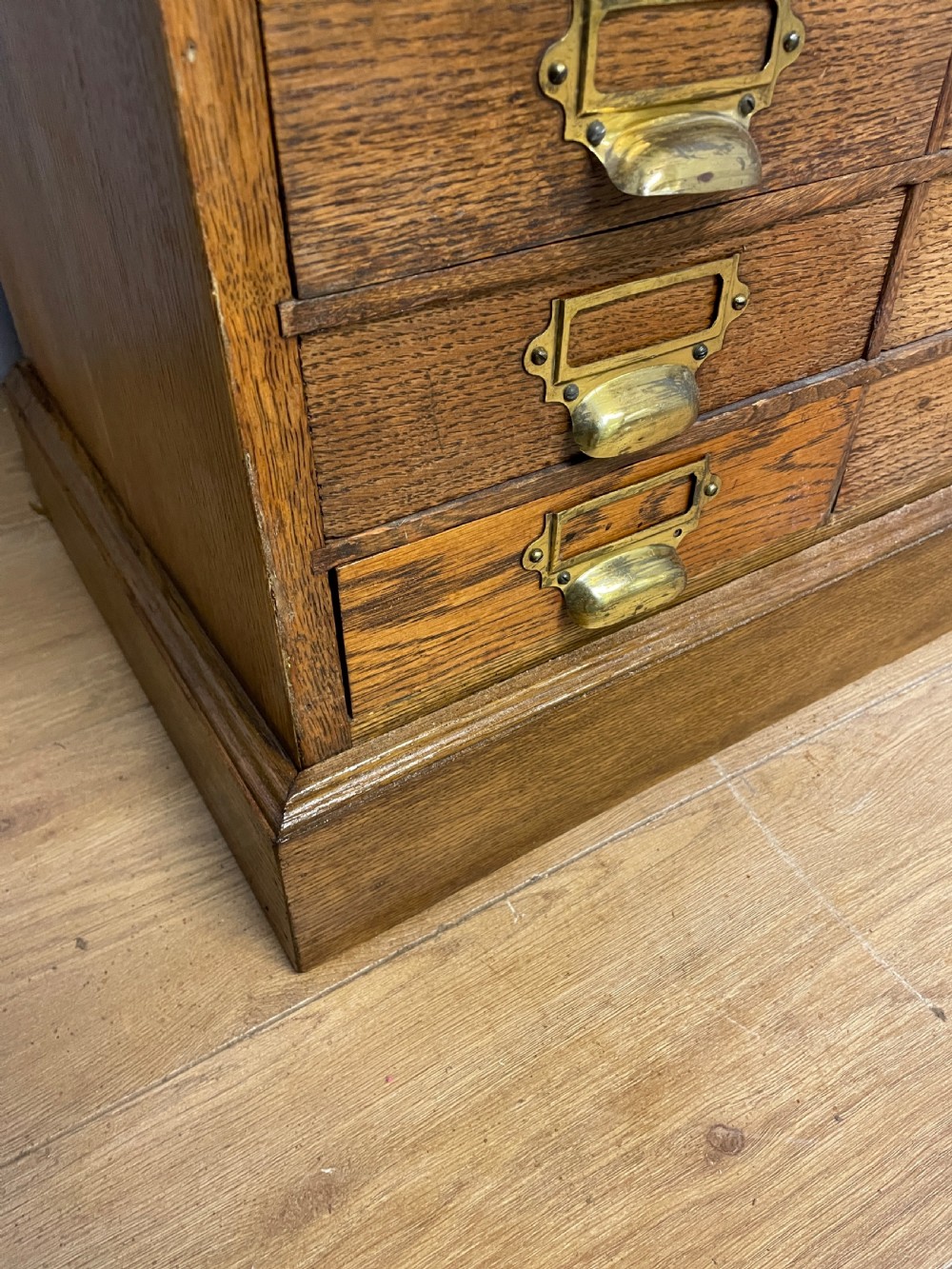 Edwardian set of 66 oak filing drawers with original brass fittings  View VIII