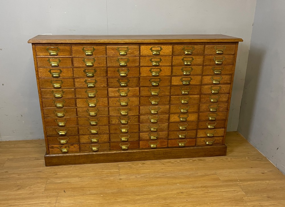 Edwardian set of 66 oak filing drawers with original brass fittings  View XIII