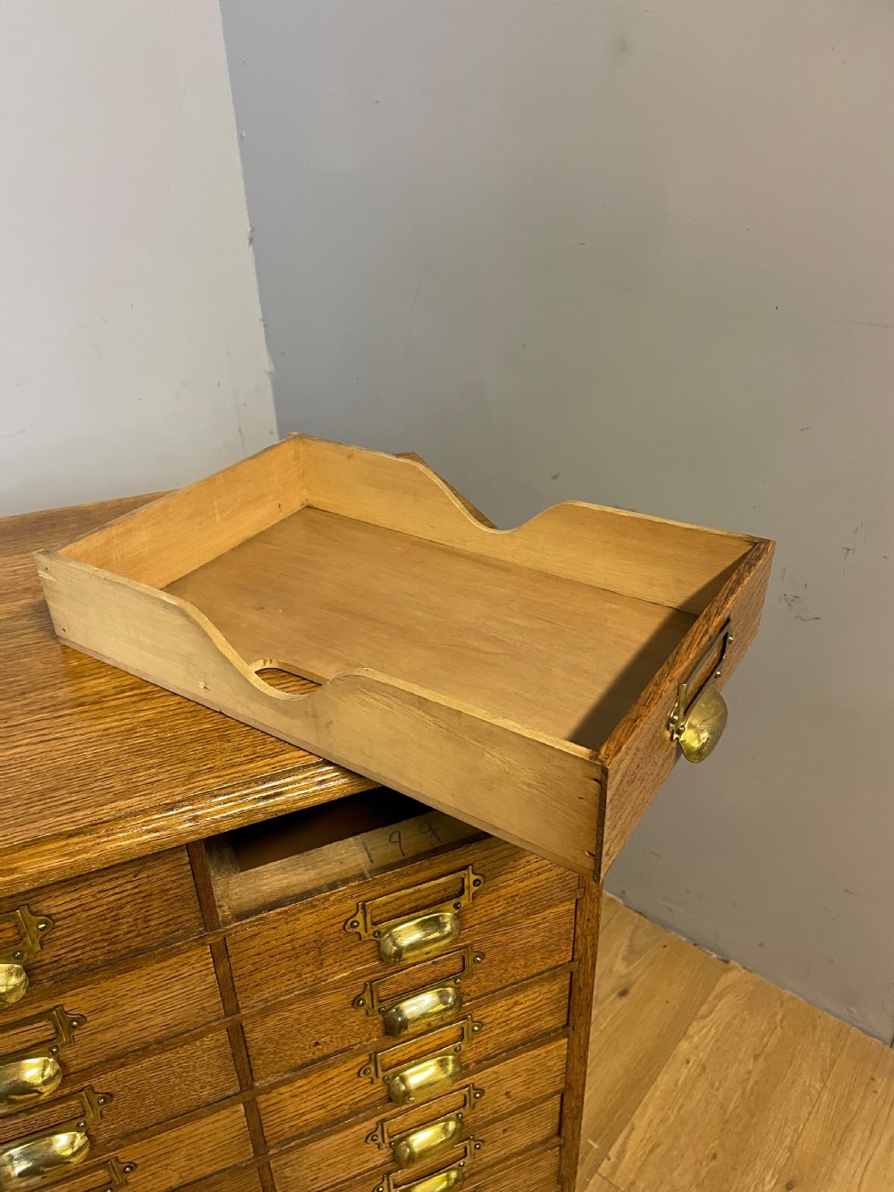 Edwardian set of 66 oak filing drawers with original brass fittings  View XIV