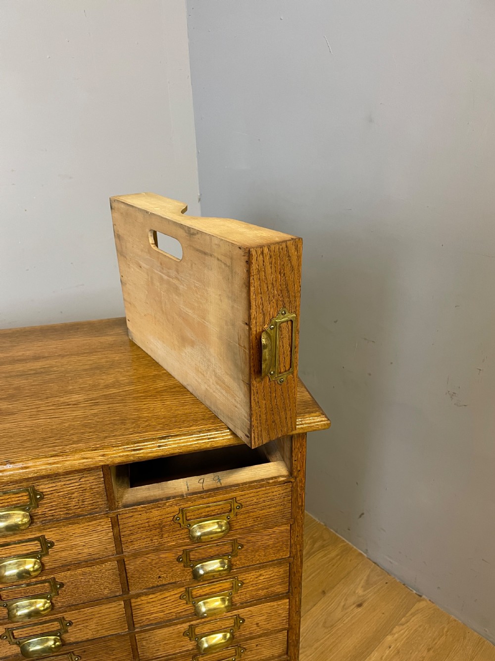 Edwardian set of 66 oak filing drawers with original brass fittings  View XVI