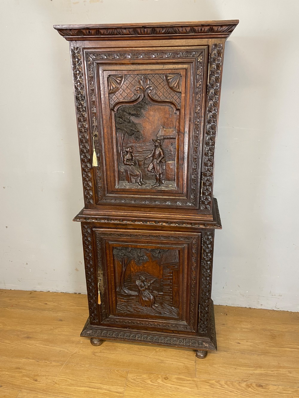 C19TH carved oak continental two door cupboard 