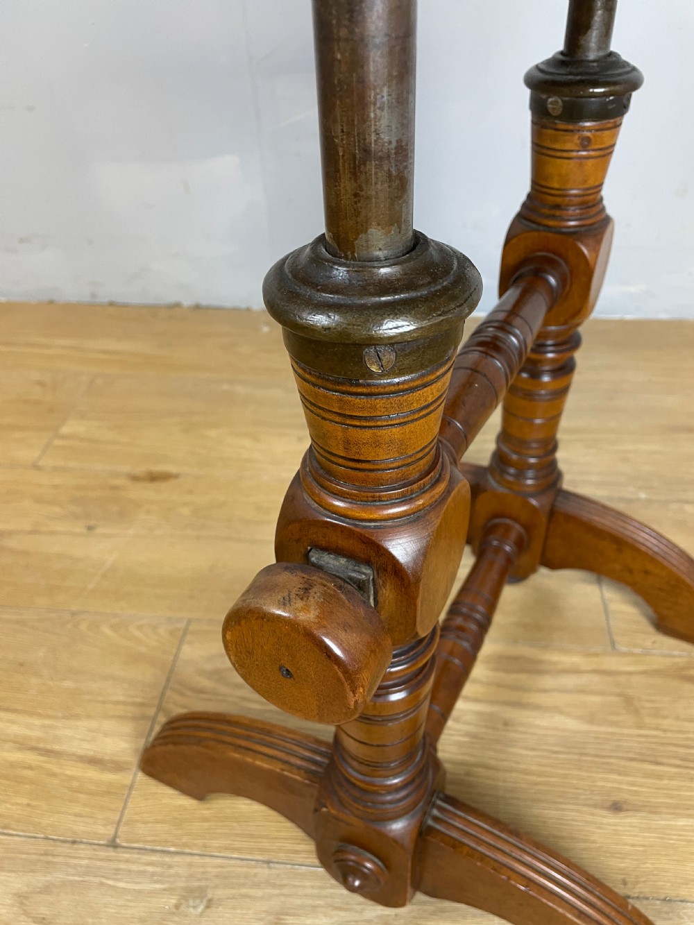 A late nineteenth-century Victorian patent music chair in polished oak featuring a green leather seat and lumbar pad trimmed with brass studs. View XI
