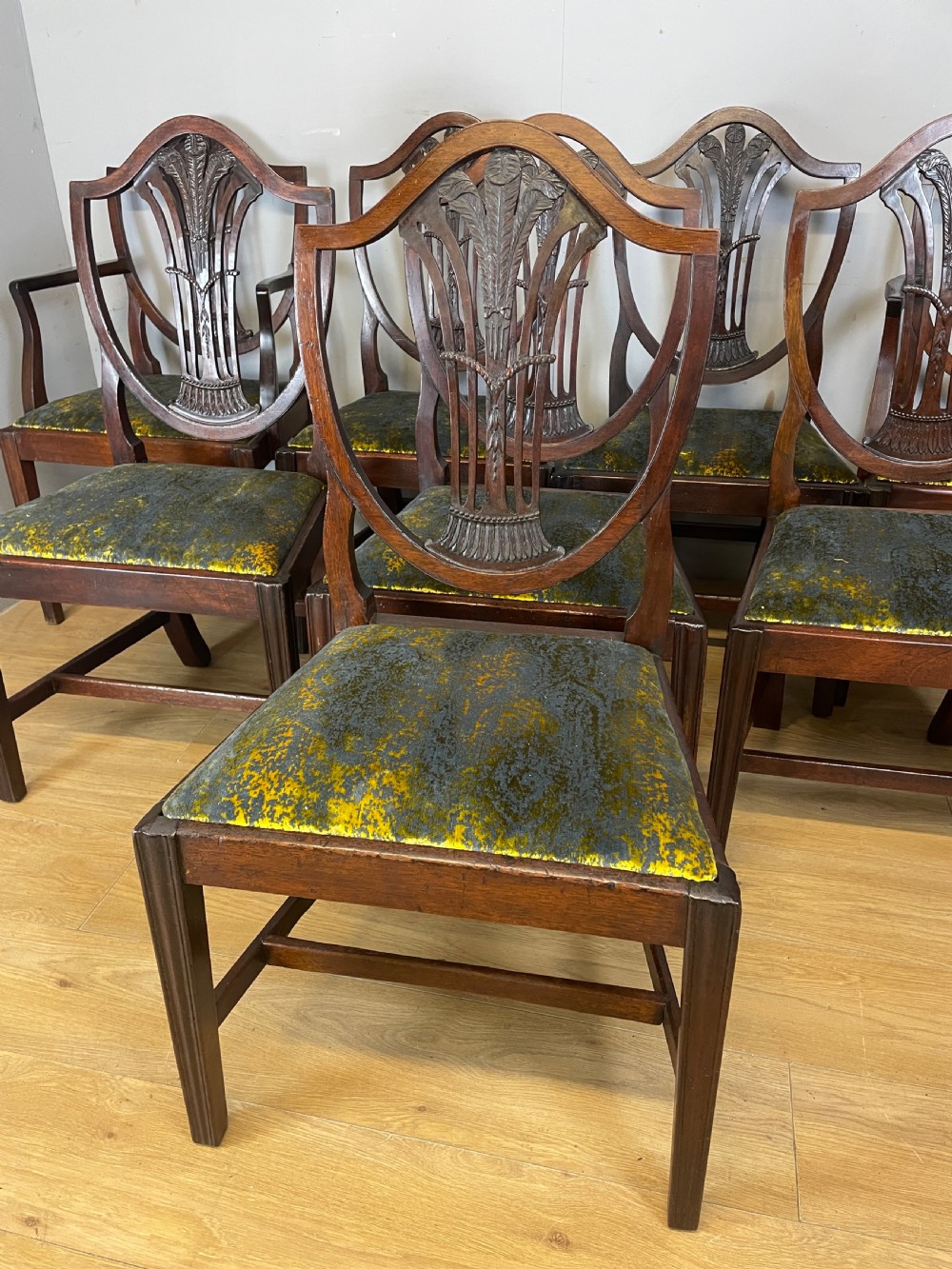 Set of eight Georgian mahogany shield back dining chairs including two armchairs with carved splats and patterned upholstered seats. View VI