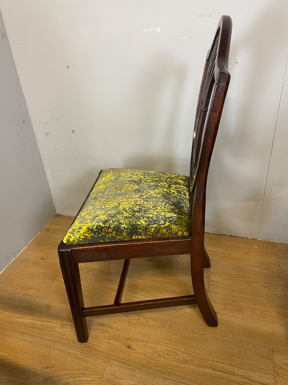 Set of eight Georgian mahogany shield back dining chairs including two armchairs with carved splats and patterned upholstered seats. View X