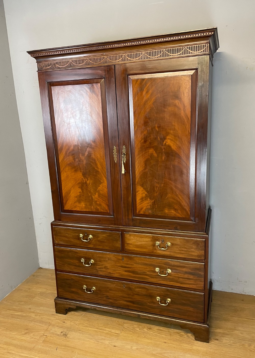Antique Georgian flame mahogany clothes press circa 1790