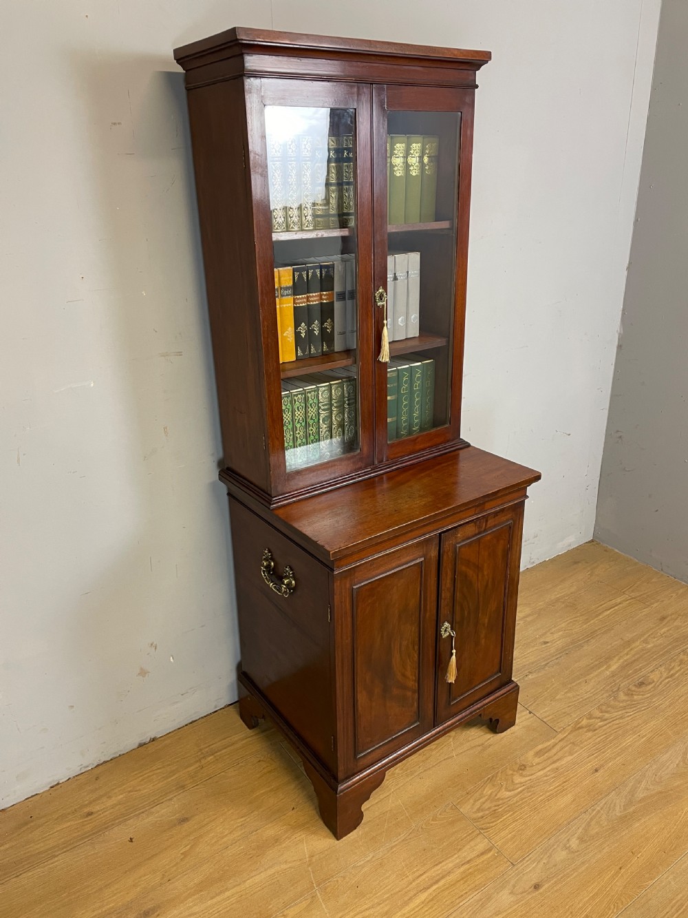 Small C19TH mahogany bookcase over cupboard Only 60 cm wide 