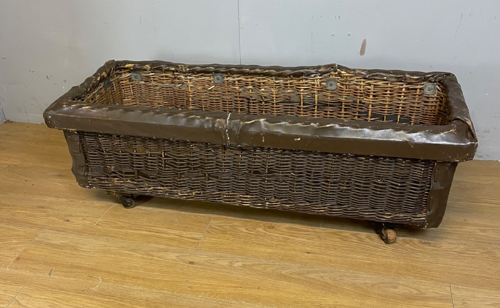 Wicker mill basket on wooden castors circa 1920