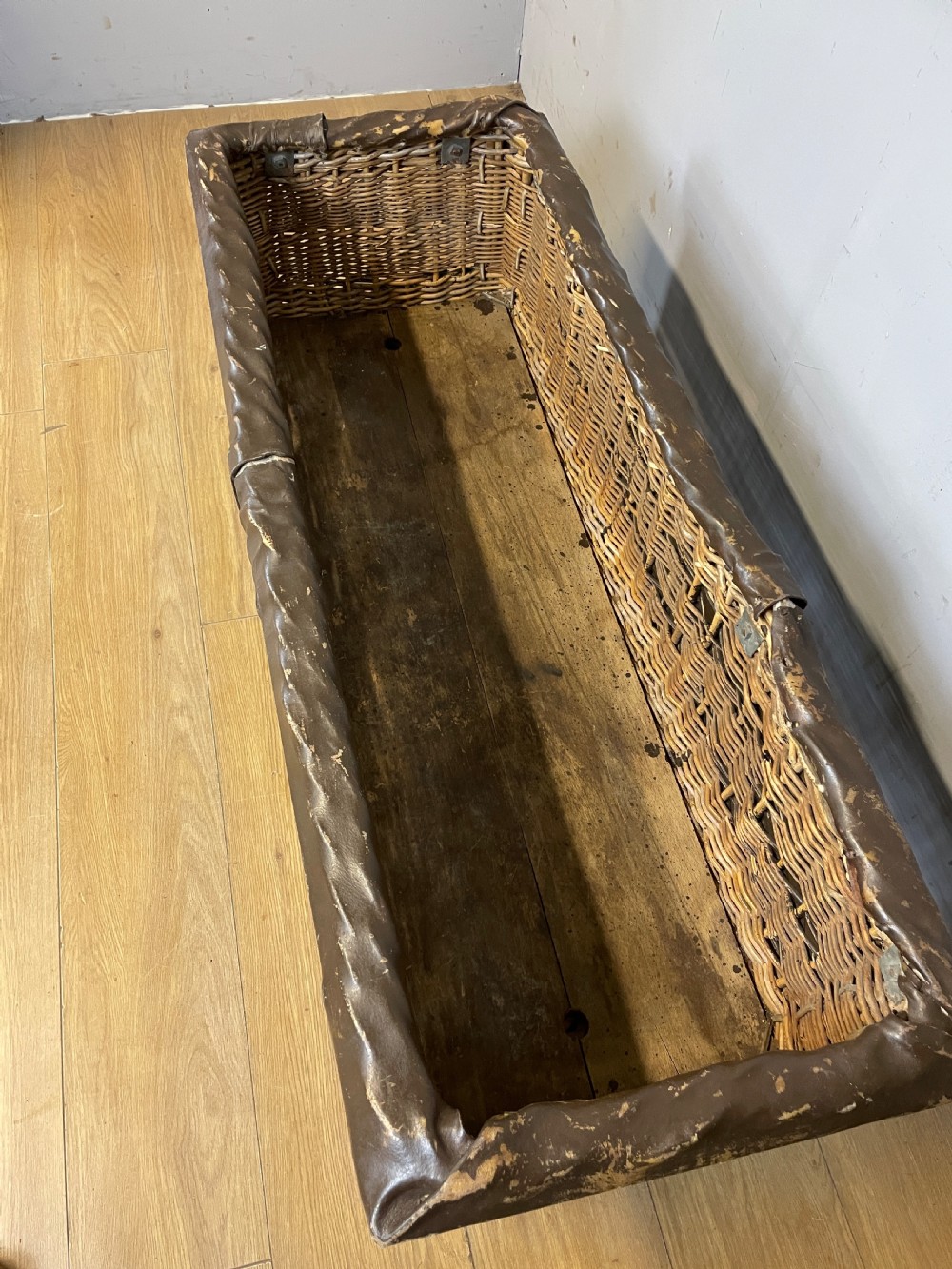 Wicker mill basket on wooden castors circa 1920 View V