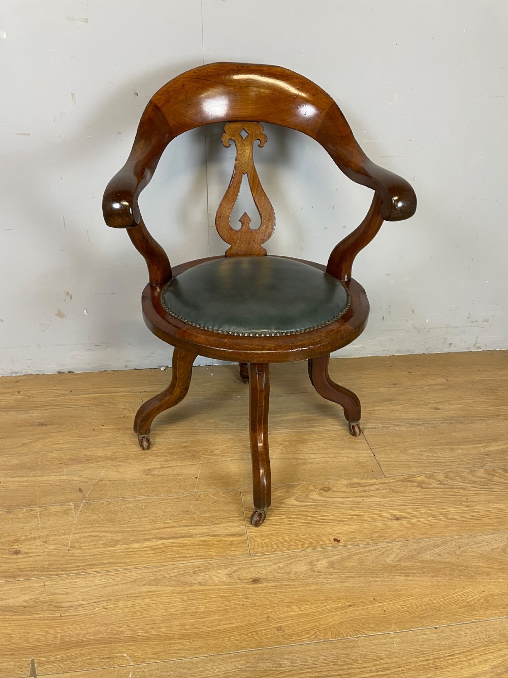 Victorian mahogany revolving desk chair with leather seat