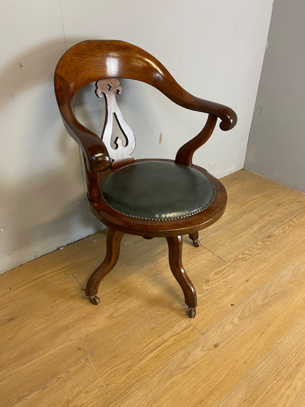 Victorian mahogany revolving desk chair with leather seat View II