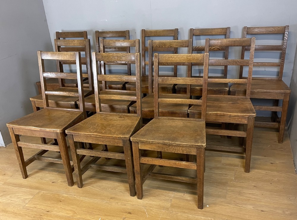 Edwardian set of 12 solid oak refectory chairs 
