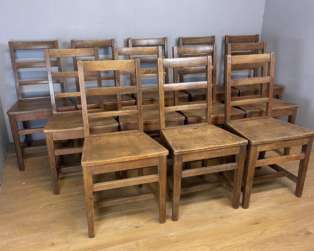 Edwardian set of 12 solid oak refectory chairs  View VI