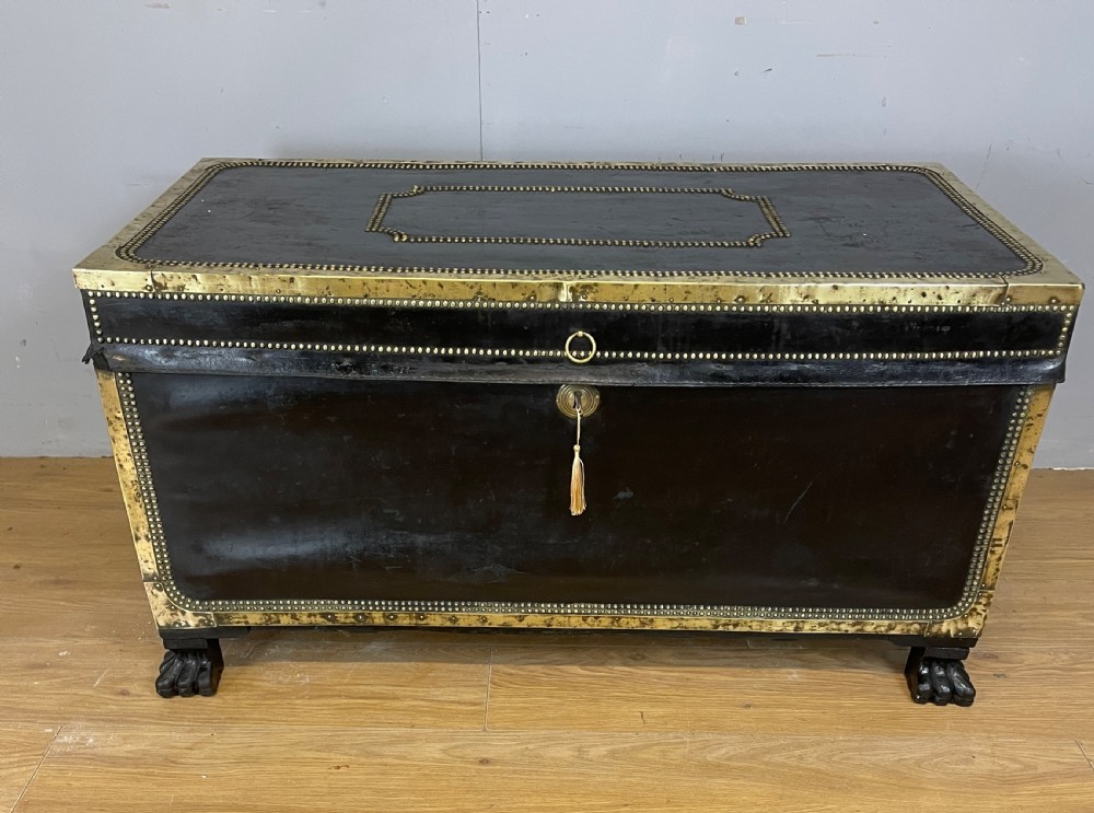 Regency brass studded leather camphor wood lined trunk on hairy paw feet  View III
