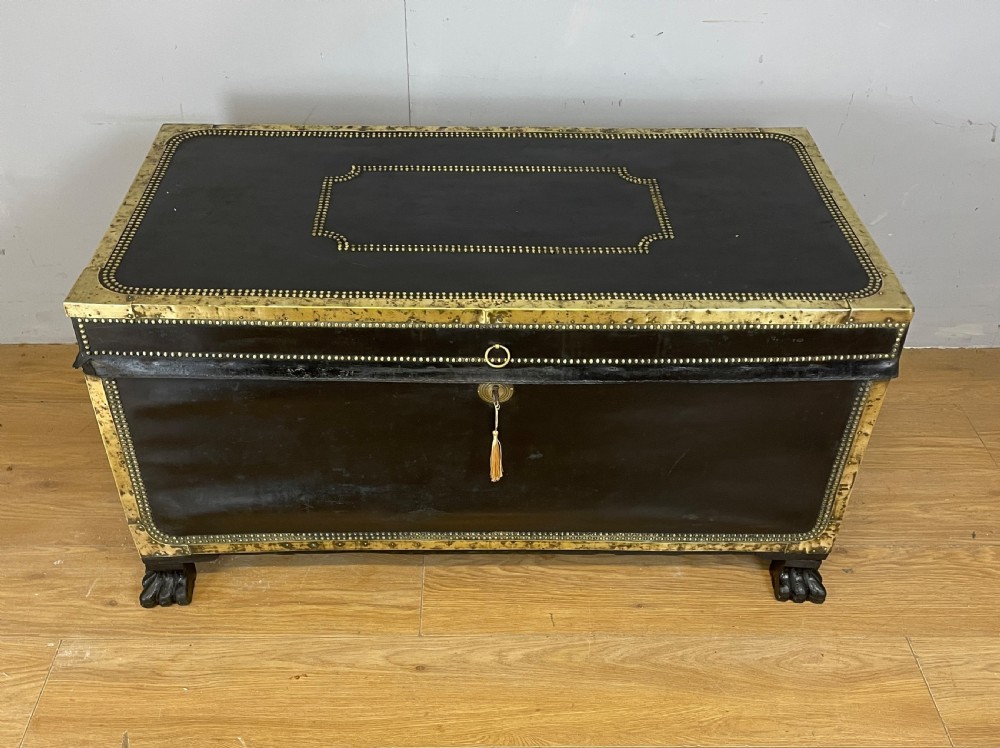 Regency brass studded leather camphor wood lined trunk on hairy paw feet  View IV