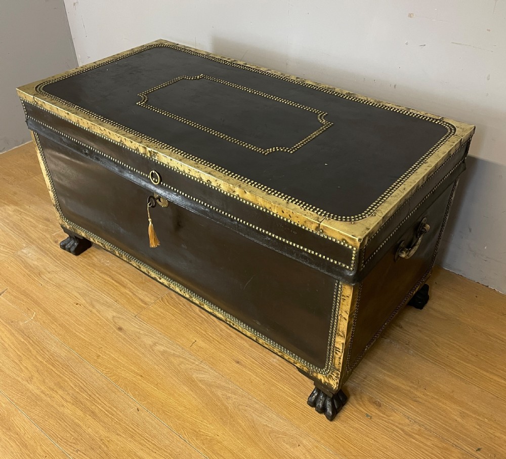 Regency brass studded leather camphor wood lined trunk on hairy paw feet  View V