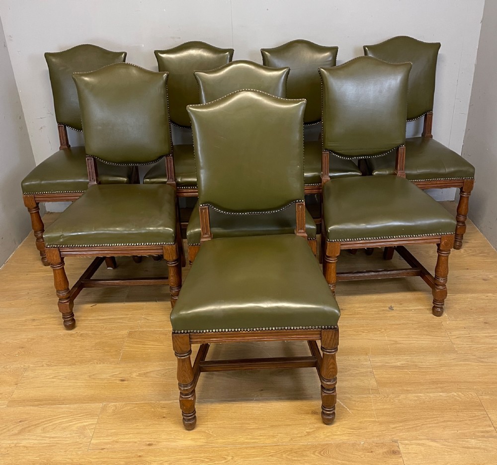 Arts and crafts golden oak set of eight dining chairs in green leather 