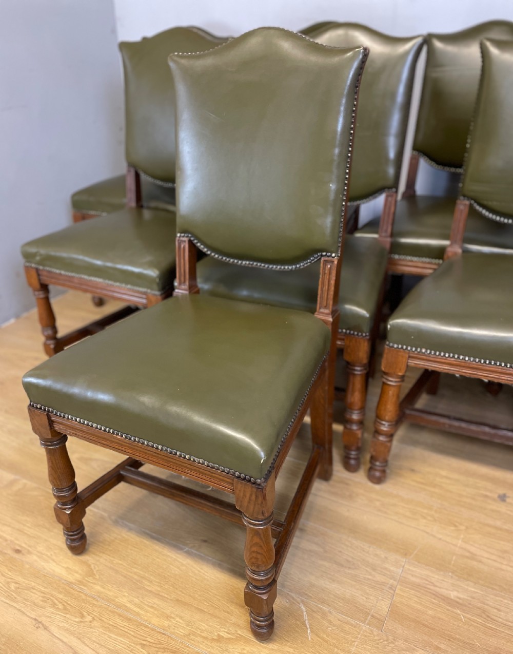 Arts and crafts golden oak set of eight dining chairs in green leather  View IV