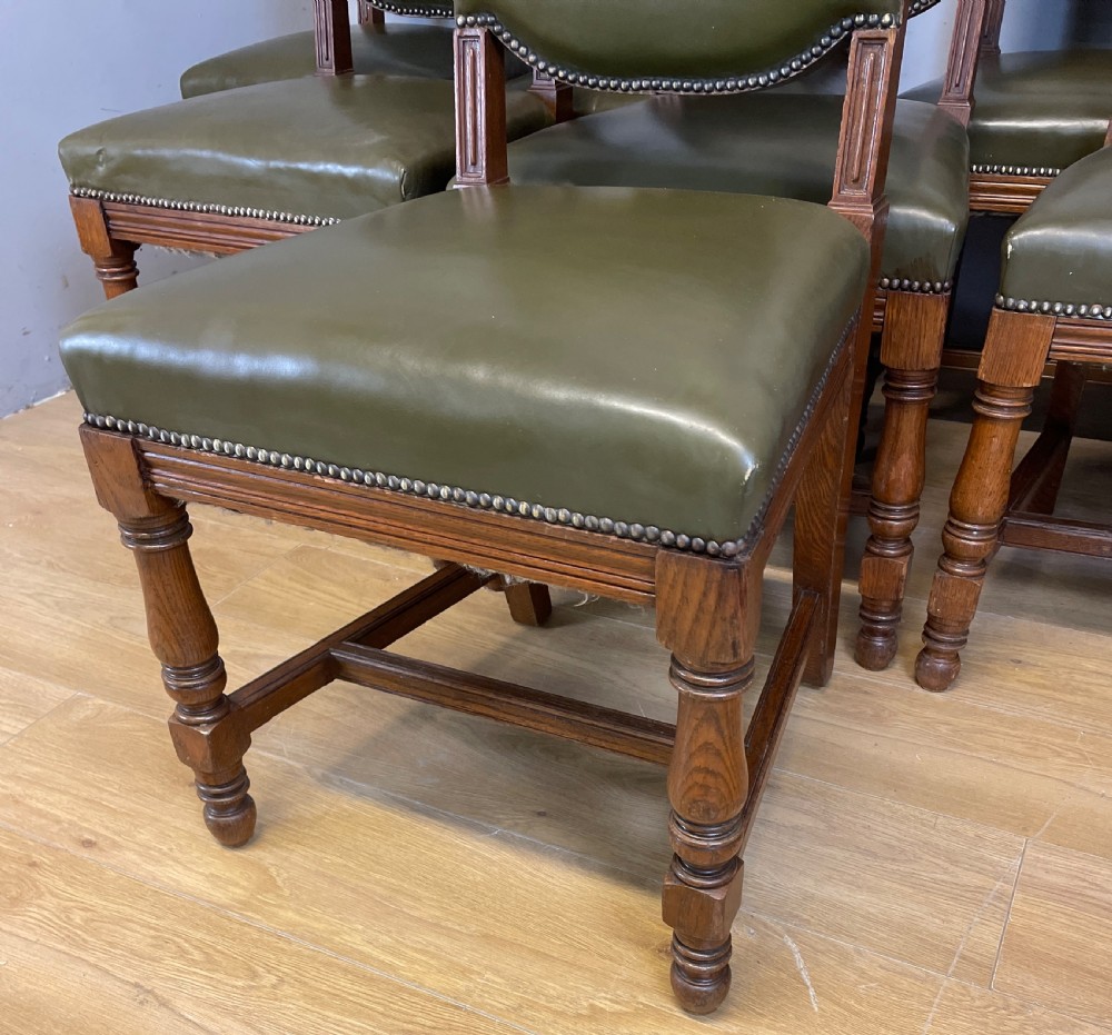 Arts and crafts golden oak set of eight dining chairs in green leather  View V