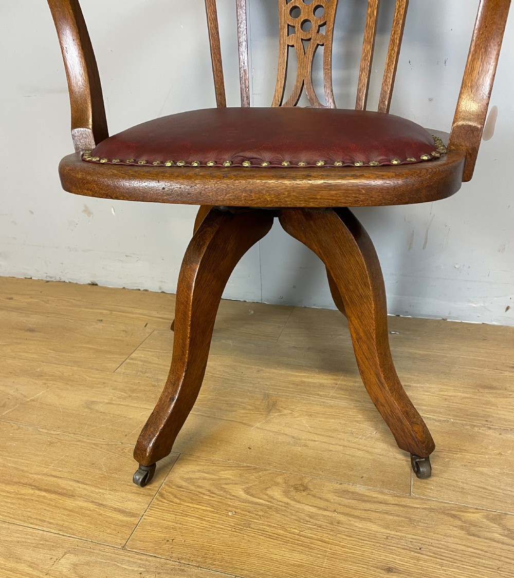Edwardian oak revolving desk chair with red leather seat circa 1910 View IV