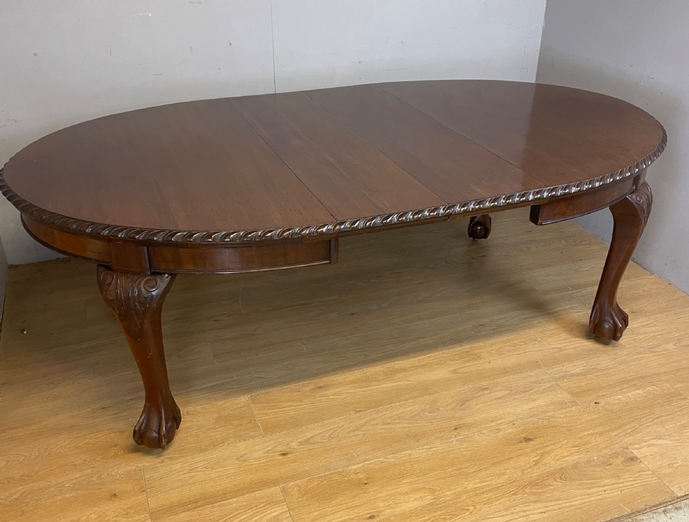 Solid mahogany Chippendale revival wind out dining table circa 1890