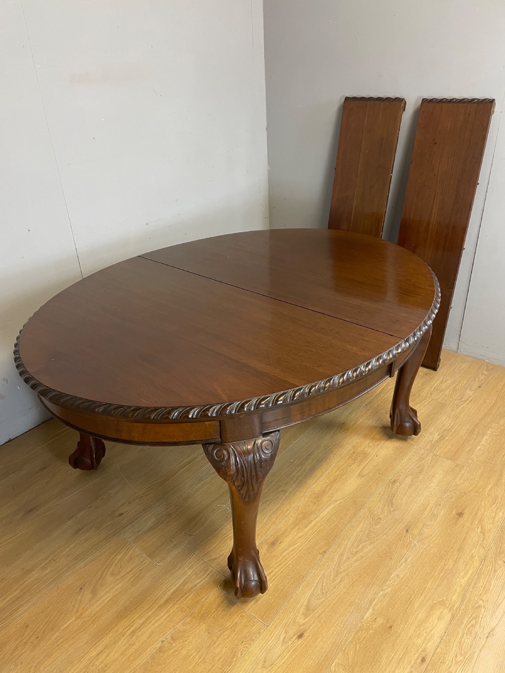 Solid mahogany Chippendale revival wind out dining table circa 1890 View IX