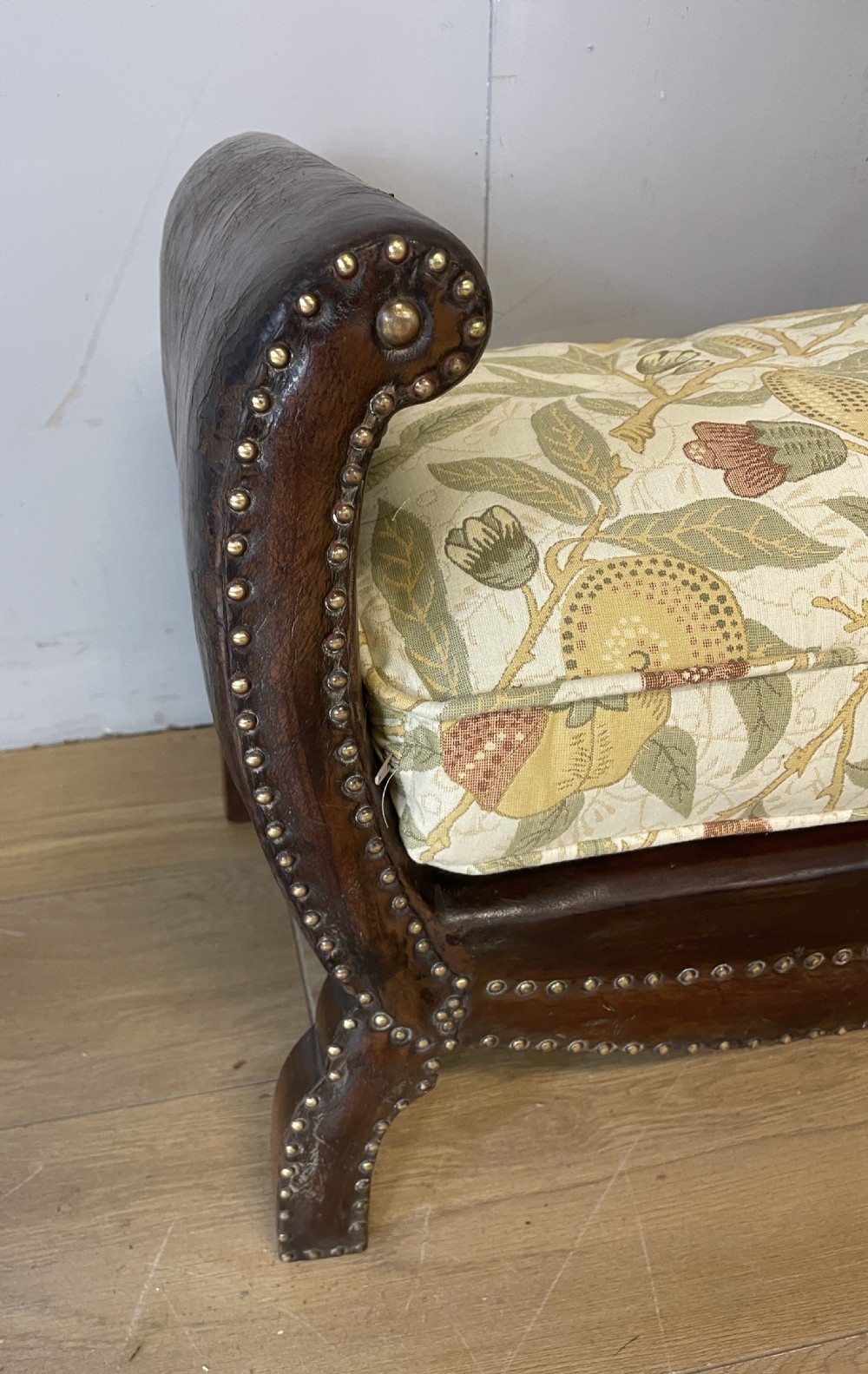 Arts and crafts leather footstool with decorative brass studs  View II