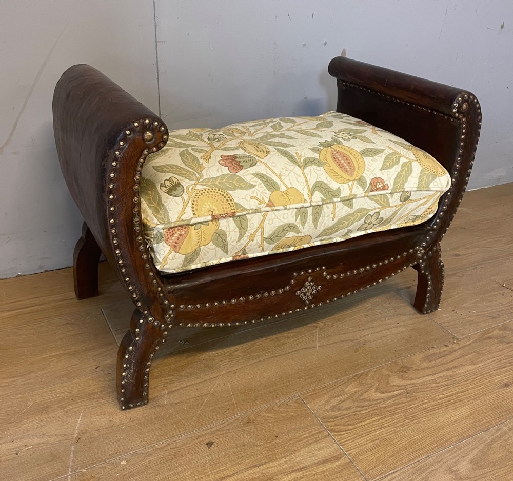 Arts and crafts leather footstool with decorative brass studs  View III