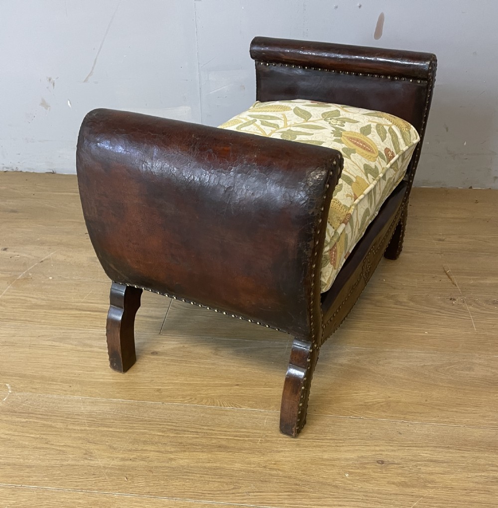 Arts and crafts leather footstool with decorative brass studs  View IV