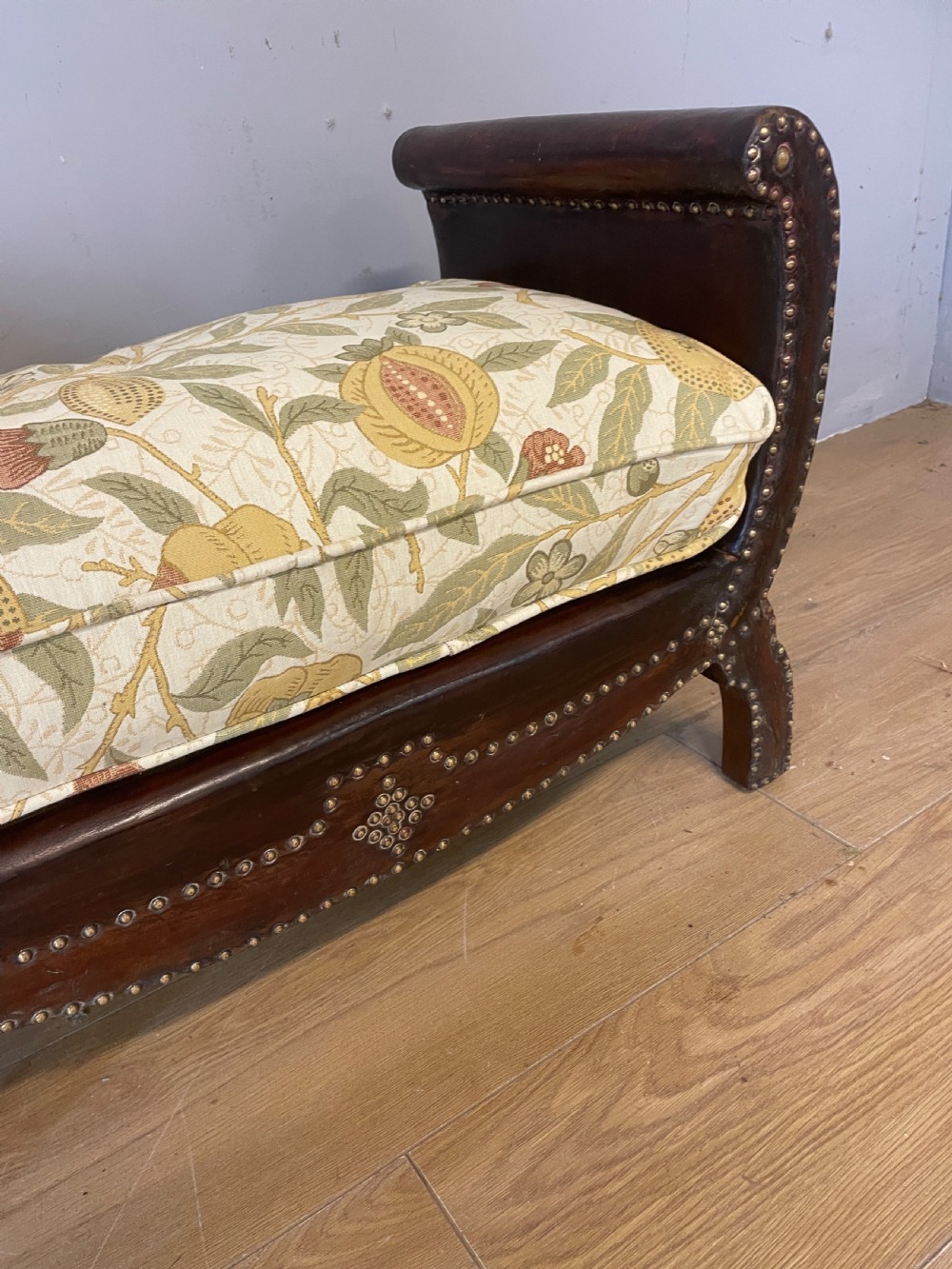 Arts and crafts leather footstool with decorative brass studs  View V