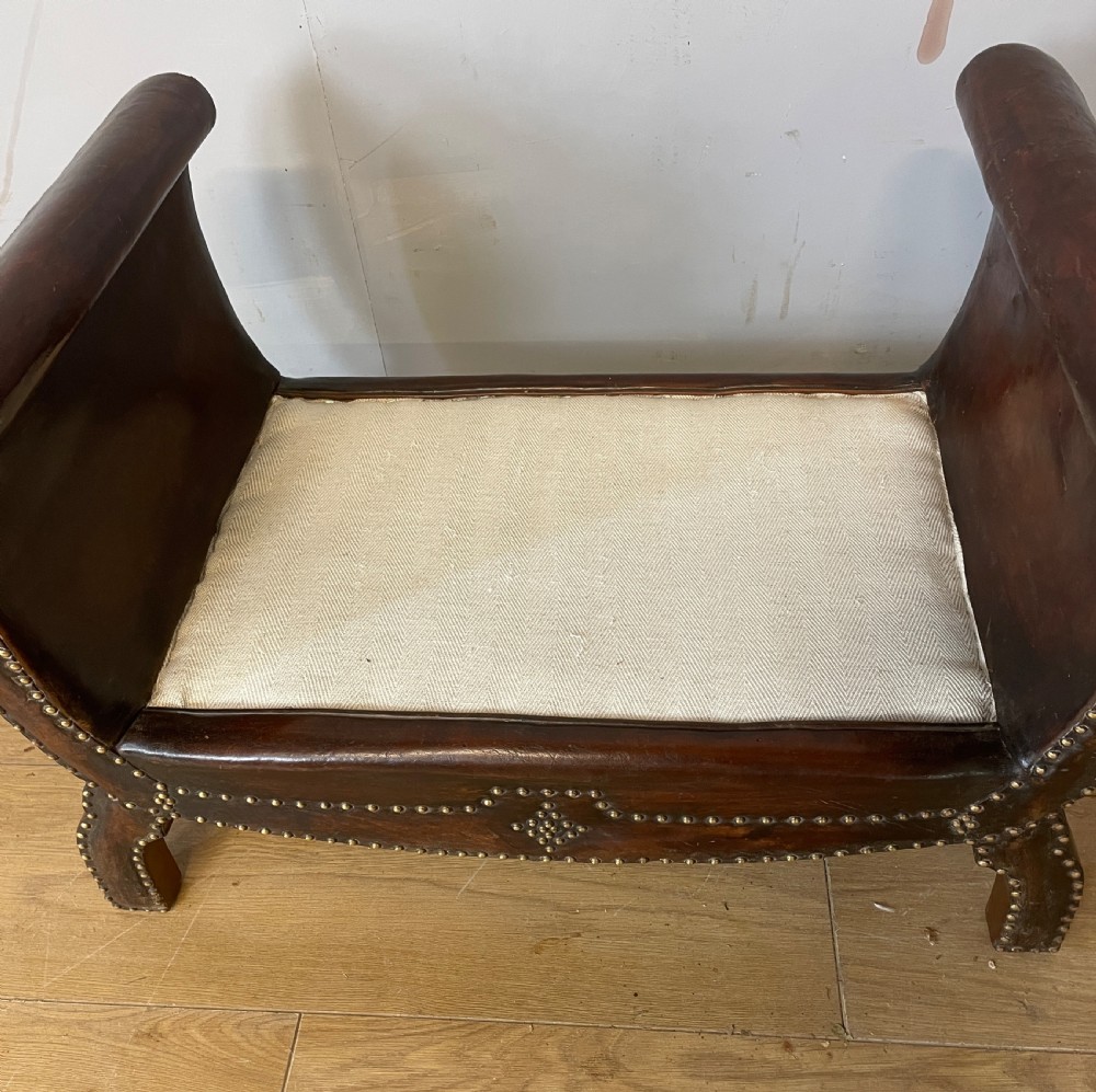 Arts and crafts leather footstool with decorative brass studs  View VIII