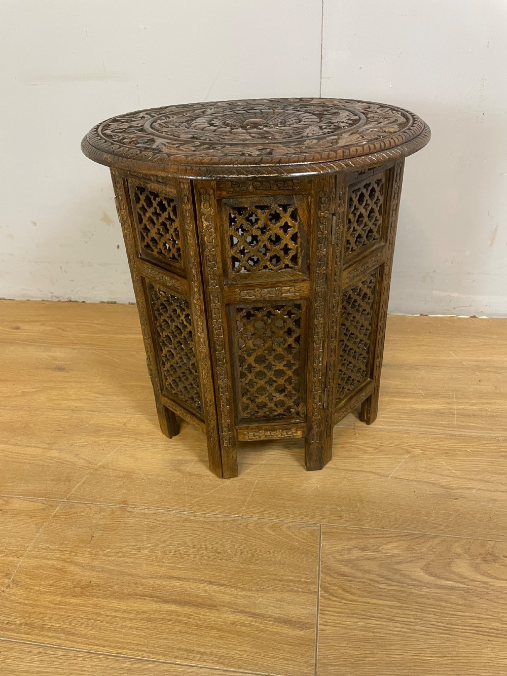 Carved circular oriental table on an octagonal base  View II