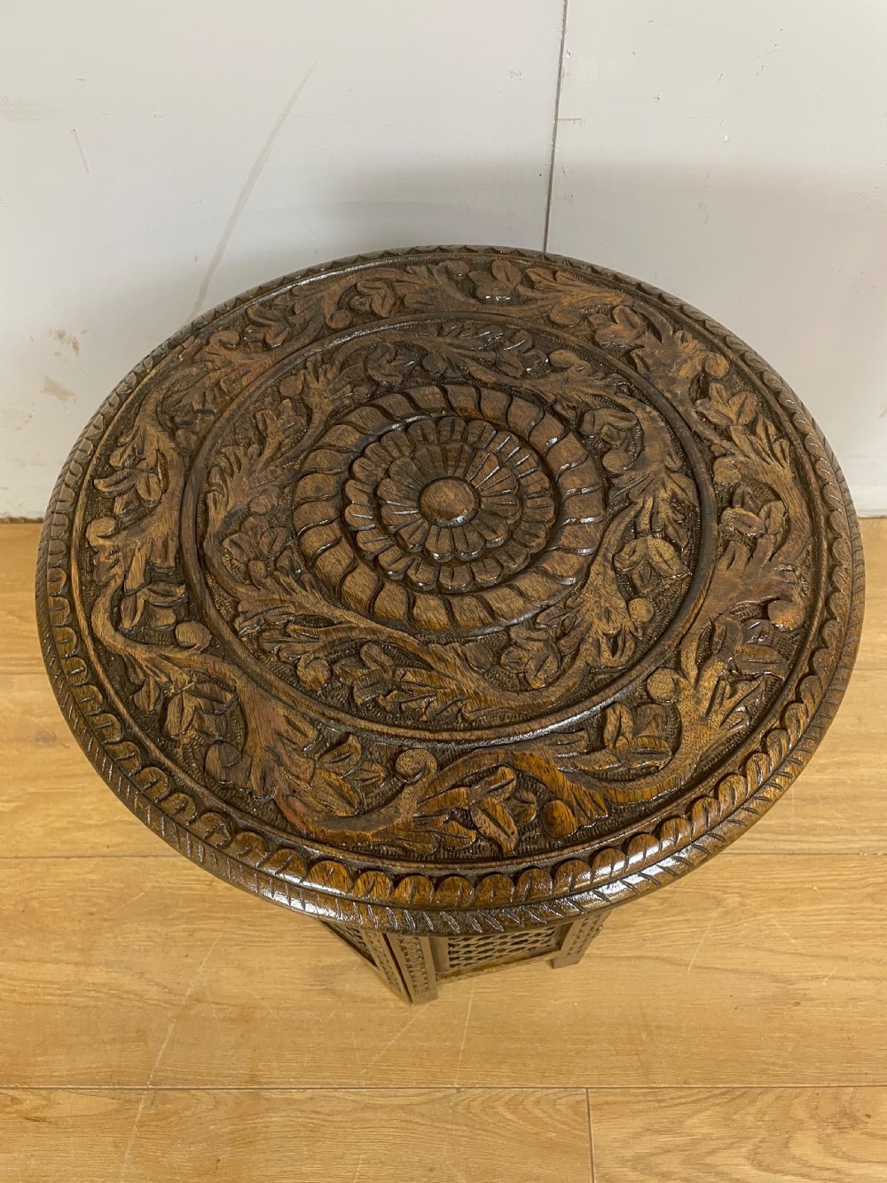 Carved circular oriental table on an octagonal base  View III