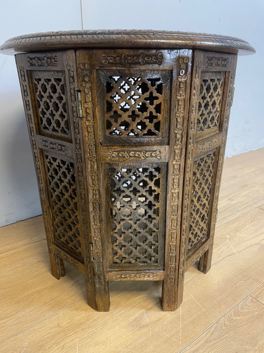 Carved circular oriental table on an octagonal base  View V