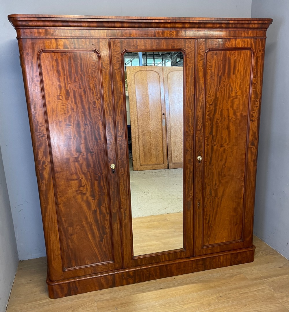 C19TH country house flame mahogany triple wardrobe  View II