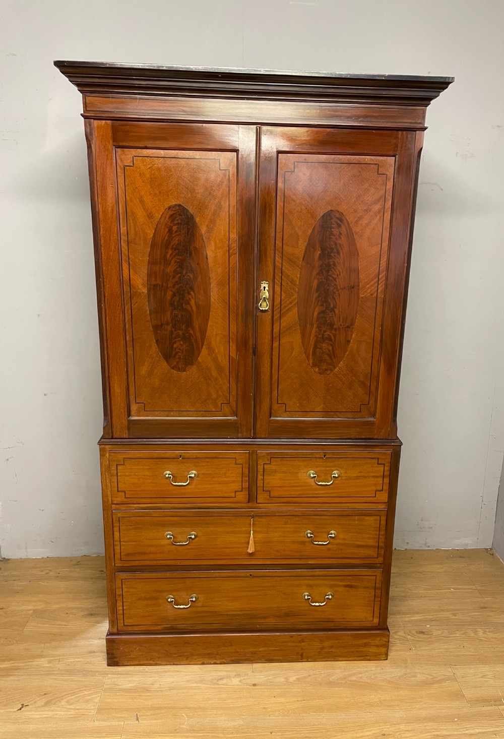 C19TH inlaid mahogany linen press by Shoolbred of London  View II